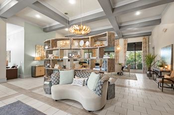 Interior of the Stonepost Crossing clubhouse with seating areas and tasteful decor.